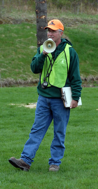 Jack E. Fisher, laboratory assistant for forest technology at Penn College (as well as Forestry Club adviser and organizer of this year's woodsmen's competition) delivers the ground rules by bullhorn.