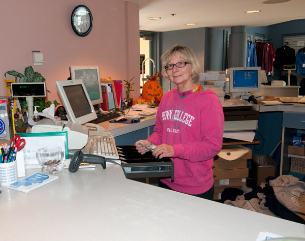 Joan Gilbert, head cashier/customer service liaison at The College Store, celebrates Friday's Pride Day in appropriate fashion.