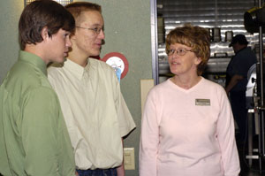 Cathy J. Michael, food services recruitment%2Ftraining specialist at Penn College, answers questions from Jason Forestal, left, and Guthrie Lowmiller as they tour the college's dining units.