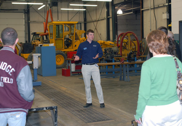 Ambassador Kevin E. Brookhart leads a group through the School of Natural Resources Management labs.