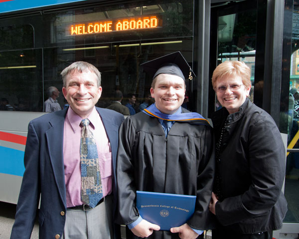 Adding a technology management degree to his postgrad toolkit, Timothy R. Cotter (a Student of the Month during the Spring 2010 semester) stands with proud parents.