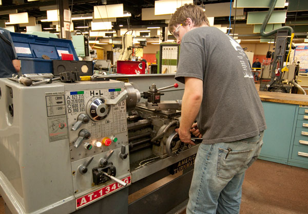 Demonstrating a metalworking lathe