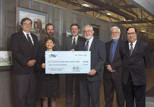 Front row, from left%3A Joann Kay, executive director of the Penn College Foundation%3B C. Fred LaVancher, chairman of the board of Larson Design Group Inc. (holding check)%3B and Robert W. Ferrell III, son of the late Robert W. Ferrell Jr. Back row, from left%3A Howard Edkin, PLS.%3B William Berger%3B Robert Weaver, PLS%3B and  Kurt Hetrick (former employees of Robert Ferrell, now Larson Design Group employees). Photo provided by Larson Design Group.