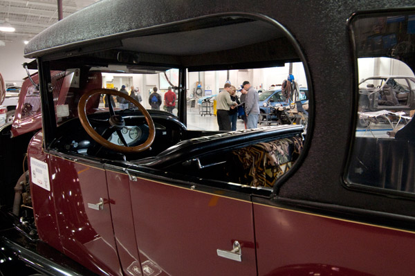 The past and future merge in the collision repair lab, as an antique automobile provides a window for faculty member Loren R. Bruckhart to talk with a potential student and his family.
