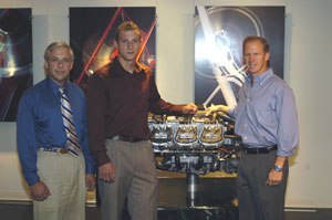 From left%3A Colin W. Williamson, Pennsylvania College of Technology's dean of transportation technology%3B inaugural scholarship recipient Raymond I. Kanapesky, an aviation student from Beaver%3B and Ian K. Walsh, Lycoming Engines' vice president and general manager, gather in the company's engine museum at its Oliver Street manufacturing facility in Williamsport.