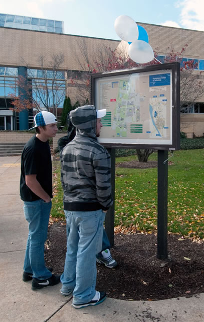 Visitors get their bearings from a campus map outside the ATHS.