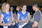 Two members of the Lady Wildcat softball team meet their public