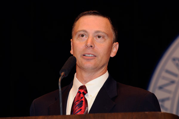 Christopher Kendig, district sales manager for Komori America Corp., accepts the college's 2009 Mentorship Award.