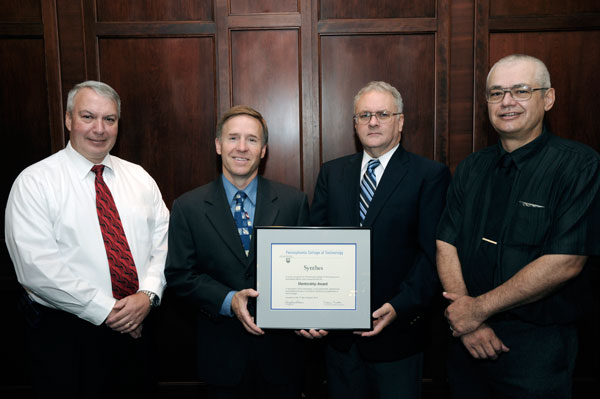 Mentorship honoree Mike Sticklin is congratulated by, from left, Bill E. Mack, assistant dean of industrial and engineering technologies; and Ed A. Hollingsworth and Tom J. Livingstone, associate professors of machine tool technology and automated manufacturing.