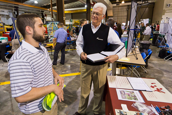 Brickman's Dave Foresman, a longtime vendor at Penn College career events, discusses "green" careers with a student. 