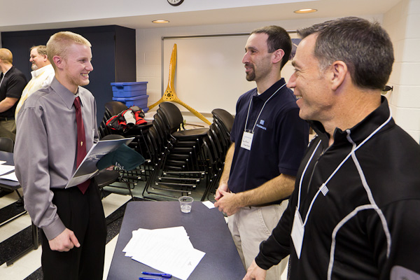 Kevin C. Pannebakker, of Harrisburg, an aviation maintenance technology student, stops by the Piedmont Airlines table.