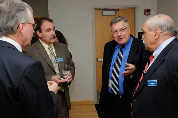 Thomas Glaser, vice president of information technology, Howard Community College, third from left, is greeted by Mike Cunningham, vice president for information technology and business; David Kay, vice president for college services; and Don Praster, dean of industrial and engineering technologies.