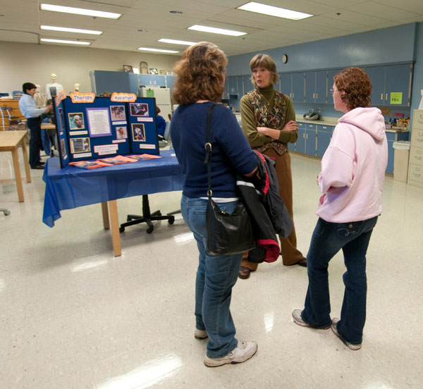 Barbara J. Natell, director of the occupational therapy assistant program, talks with guests.