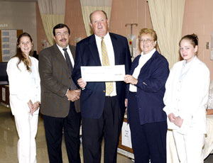 From left, are Lauren B. Vanderlin of Montoursville, a nursing student who received grant funds last year%3B Paul H. Rooney Jr., a member of the Blue Cross of Northeastern Pennsylvania Board of Directors and the Penn College Foundation Board%3B John Comerford, western region director for Blue Cross%3B Pamela L. Starcher, director of nursing at Penn College%3B and nursing student Leann M. Wetzel of Williamsport.