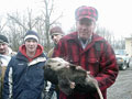 Donald Nibert holds an opossum