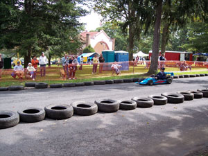 Joshua M. Poole drives go-kart in Sunday's parade laps.