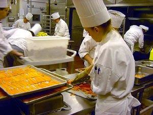 Students help to prepare a meal for about 1,000 guests at The Penn Stater during last year's annual PASA Conference.