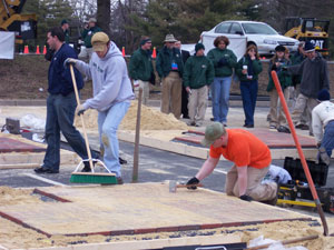 Mark  A. Todd and Andrew A. Wilde compete in paver installation.