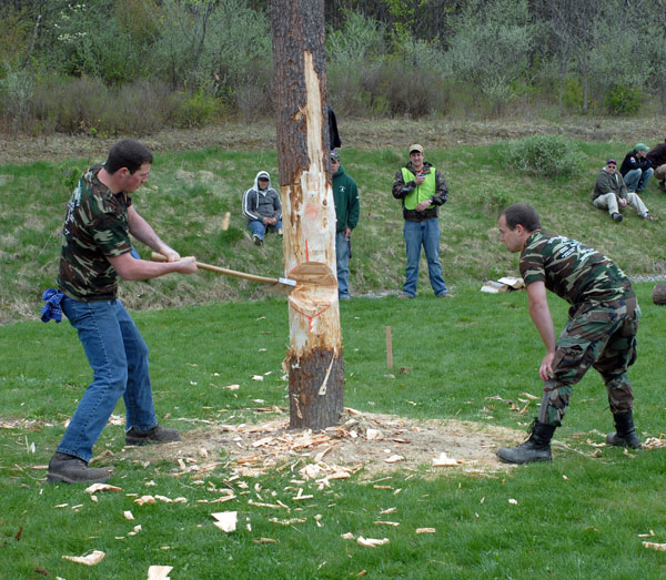 Coached by teammate Michael C. Frantz, Brian A. Tomassacci prepares to fell a pole as close as possible to a nearby stake. The duo placed third in the event.