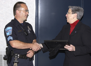 Sgt. David L. Mauck receives his award from Dr. Gilmour.