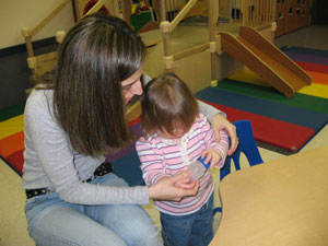 Emily A. Crosby, of Mifflinburg, works with a child during her practicum at the Mifflinburg Children%E2%80%99s Center.