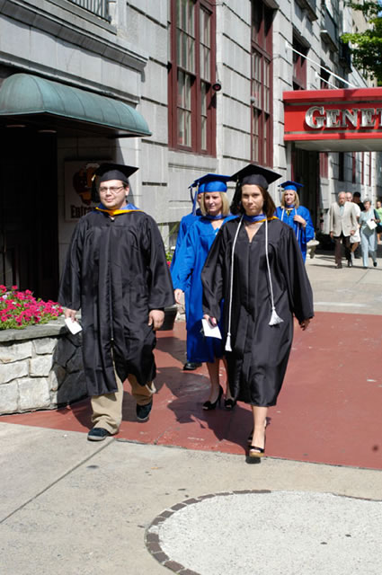 The commencement contingent begins its march to the Arts Center.