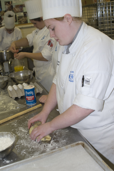 Baking and pastry arts student Emily Mead prepares a farmers bread during a class visit by internationally renowned baker Dominique Homo.