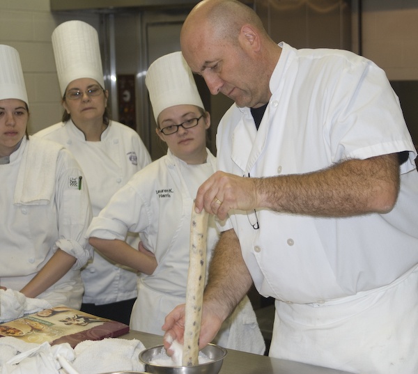 Dominique Homo, a baking consultant and owner of LEcole du Pain in Quebec, instructs baking and pastry arts students in making raisin cookies.