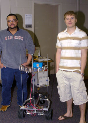 Ajaiah T. Connelly, of Williamsport, left, and Nicholas R. Fantaske, of State College, both seniors in the electronics engineering technology major, display their autonomous robotic vehicle.