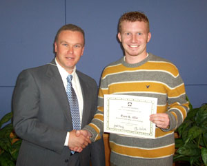Ryan K. Allar (right) is congratulated by Carl J. Bower Jr., a part-time horticulture instructor at Penn College.