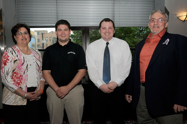 Cheryl and Edward Garis meet the phenomenal forces behind the scholarship in memory of their daughter: Gregory J. Miller (second from left) and Adam J. Yoder.