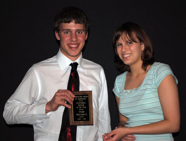 Senator of the Year Tyler J. Frederick is congratulated by Alyse M. Poswiatowsky.