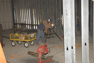 Welding takes place in the future laboratory that will give space to senior project work.