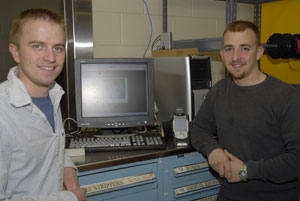 Bradley S. Galloway, left, and Eric A. Maschuck with components of the inventory-management system they developed for the electronics and computer engineering technology department%E2%80%99s toolroom at Penn College.