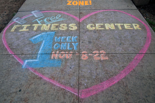 Putting the "fit" into graffiti, this sidewalk message promotes a free week's membership in the campus health facility.