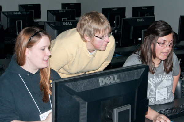 Kathy Walker offers assistance during a computer aided design session called Experience the 3rd Dimension.