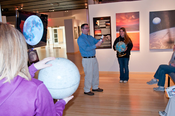 David S. Richards, professor of physics, demonstrates manned flights to the moon in The Gallery at Penn College.