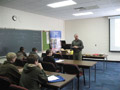 Instructor Jack E. Fisher greets students and outlines the day's events