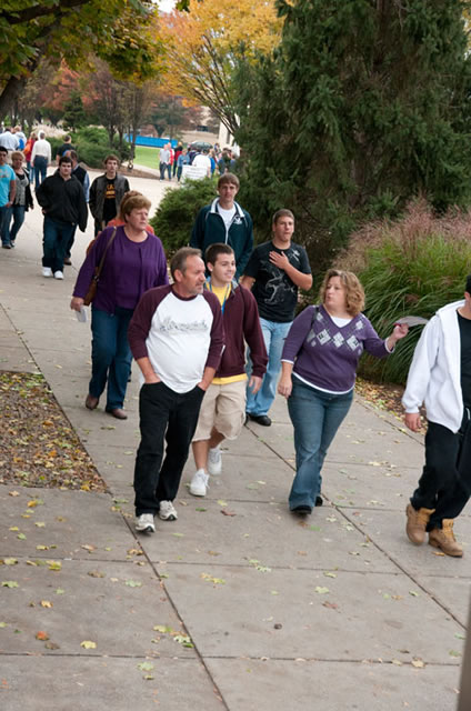 Open House visitors stroll main campus in the pleasant fall air.