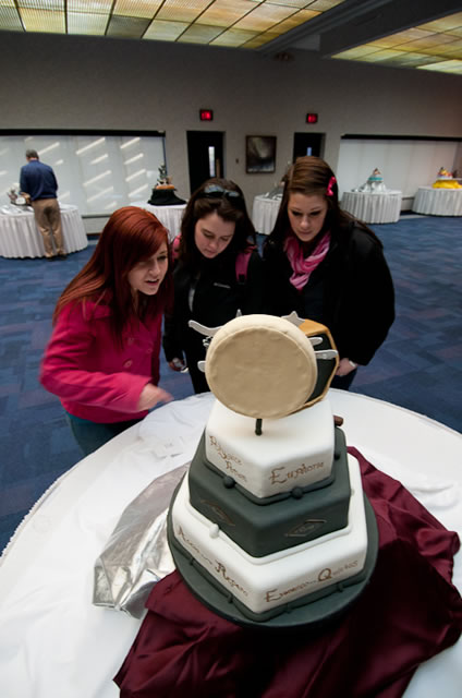 Three School of Hospitality freshmen, eagerly awaiting the same cake-crafting opportunity, view their fellow students' labors. From left are Megan R. Larkin, a baking and pastry arts major from Ridley Park; Katelyn M. Rusnak, culinary arts technology, Coraopolis; and Alisha M. Howell, also baking and pastry arts, from Waymart.