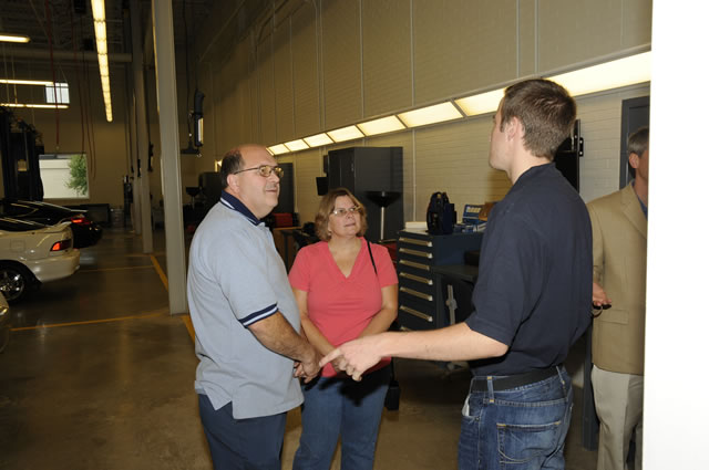 Student Ethan Griffin, an automotive technology: Honda emphasis major, conducts a tour of the ATC.