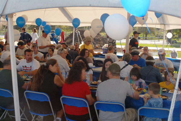 A Saturday crowd enjoys delicious tailgate fare under a Dining Services tent behind the Field House.
