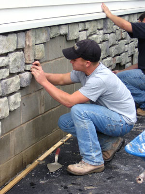 Nicklaus H. Kelley, a masonry student from Purcellville, Va. (foreground) and Gregory P. Schneyman, a residential construction management major from Morris Plains, N.J., painstakingly find and fit the right stones for the job.