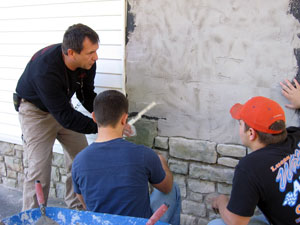 Glenn R. Luse, instructor of building construction technology, gives on-the-job direction to Pennsylvania College of Technology masonry students Jason R. Sheridan, of Archbald (center), and Daniel E. Mumma, of Camp Hill.