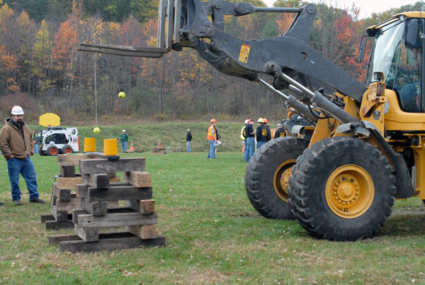 A heavy-equipment operator deftly completes his task during the ESC rodeo.