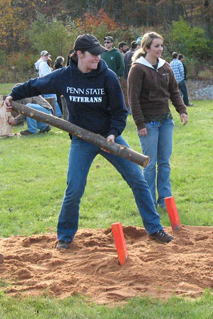 Taking part in the Woodsmen's Meet at the ESC, a Penn State competitor heaves a log.