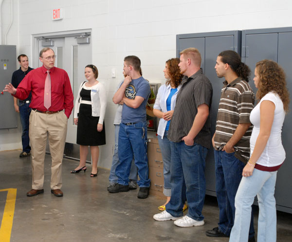 A number of automotive alumni join Steven H. Wallace, assistant dean of transportation, for a tour of the expanded ATC labs.