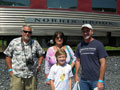 Ken Kinley, a 2001 graduate and a Penn College employee (right), and family await the 'All Aboard'