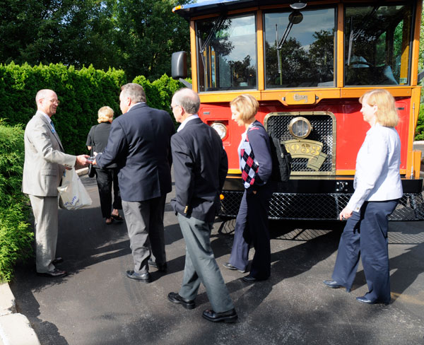 Barry R. Stiger, vice president for institutional advancement, distributes mementos to campus visitors.