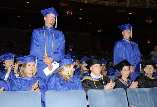 Student veterans rise in tribute from the audience, which soon groundswelled to a standing ovation.